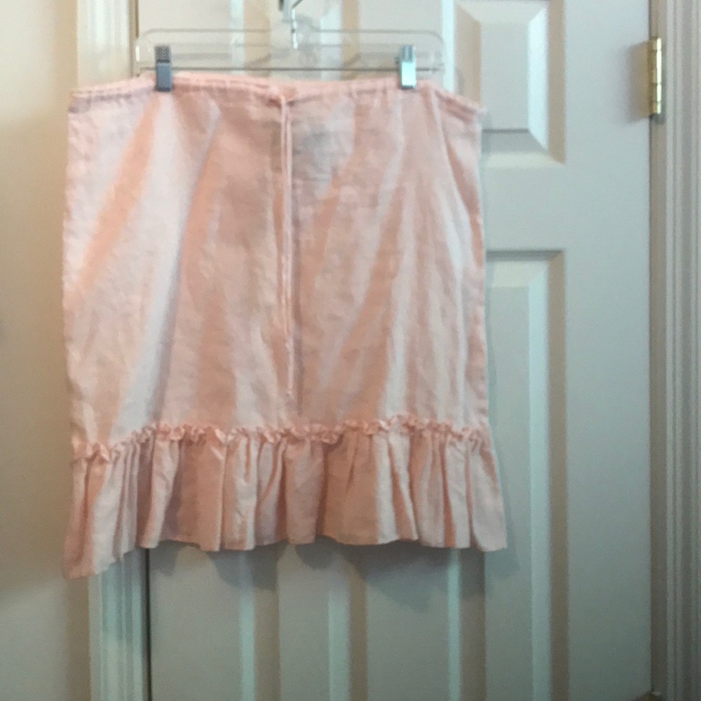 Baby pink linen skirt with ruffle bottom. Size L.